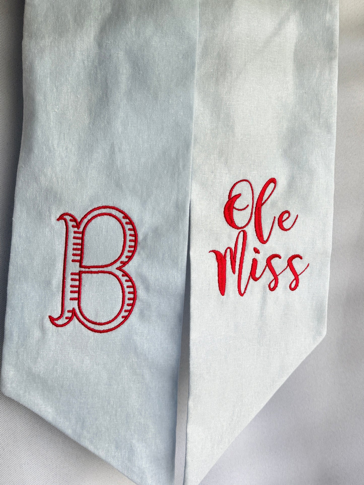 light blue fabric with red text and ole miss football design with a customizable embroidered monogram